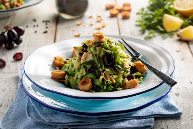 Buddha bowl raw food Brussels spourt salad served in dish isolated on wooden table side view