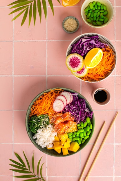 Buddha Bowl Rice with salmon radish red cabbage edamame beans and sesame seeds The concept of delicious and healthy food Top view Space for copying