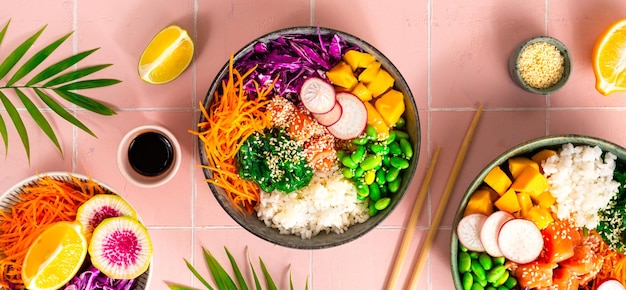 Buddha Bowl Rice with salmon radish red cabbage edamame beans and sesame seeds The concept of delicious and healthy food Top view