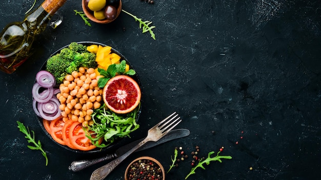 Buddha bowl Turkish peas broccoli tomatoes onions Top view Free space for your text