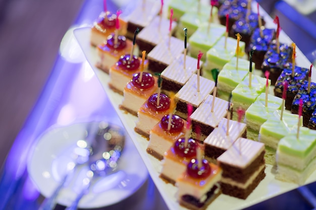 buffet food, catering food party at restaurant, mini canapes, snacks and appetizers