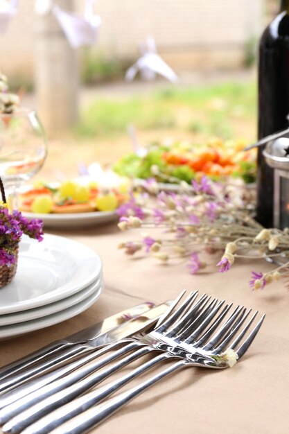 Buffet table with dishware waiting for guests