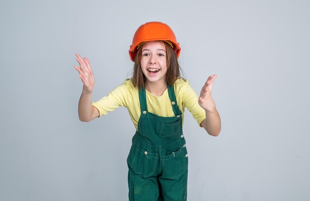 Build your future yourself international workers day electrician is her career girl in helmet plays builder building and renovating kid build construction engineer teen is construction worker