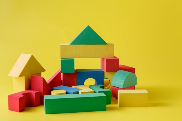 Building blocks on bright yellow surface