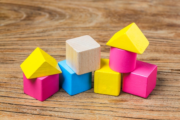 Building blocks on wooden background，Colorful wooden building blocks