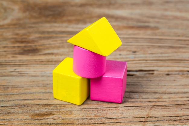 Building blocks on wooden background，Colorful wooden building blocks