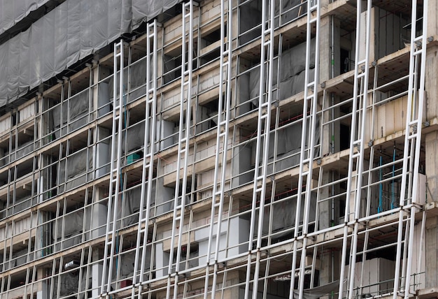 Building construction site with steel scaffold