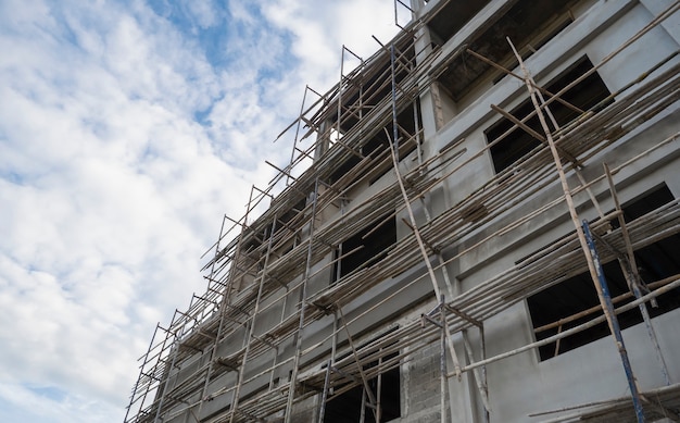 Building under construction with cloudy blue sky