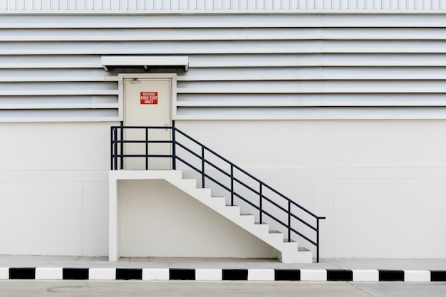 Building Emergency Exit with Exit Sign and Fire Extinguisher.