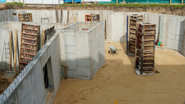 Building foundation construction Monolithic concrete and reinforced concrete structures on the construction site The use of metal formwork and fittings in construction