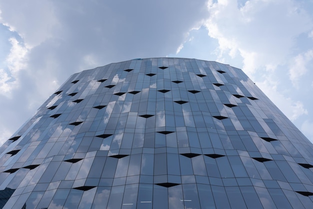 Building glass curtain wall and blue sky and white clouds