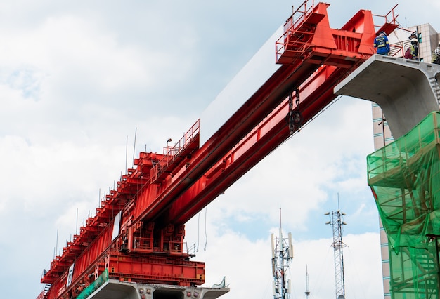 Building railway concrete structure using truss launcher, Skytrain construction in progress