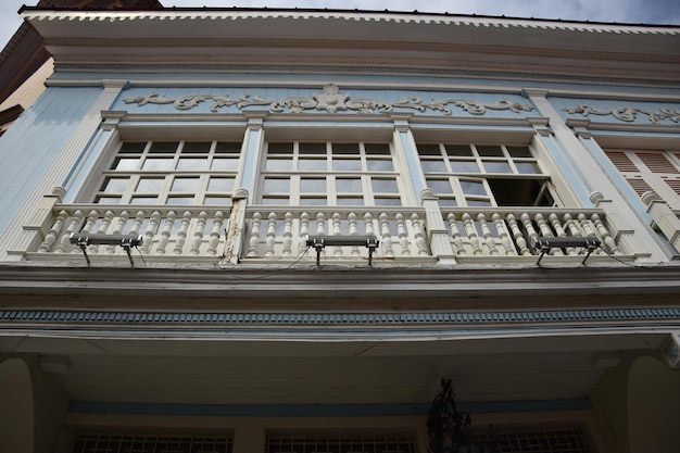 A building with a balcony on the street in historic Las Penas neighborhood in Guayaquil