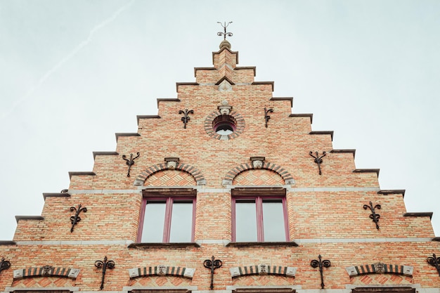 a building with a clock on the top and the word  o  on the top