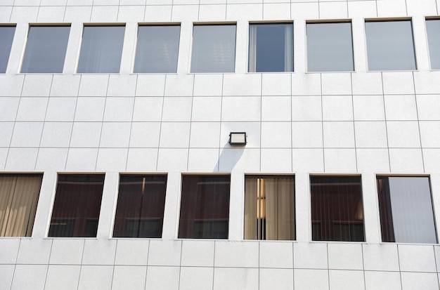 A building with windows and a clock on the front