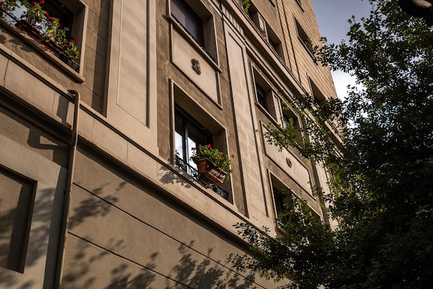 Building with windows and evening sun light and shadows Sunset in the city Barcelona Spain