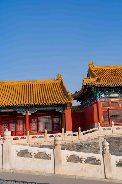 A building with a yellow roof and a red roof