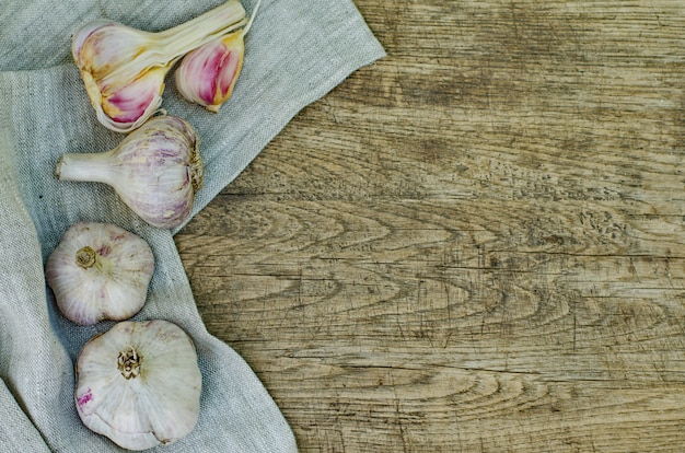 Bulbs of garlic on a rustic wood