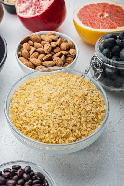 Bulgur grain in a bowl and fresh ingredients