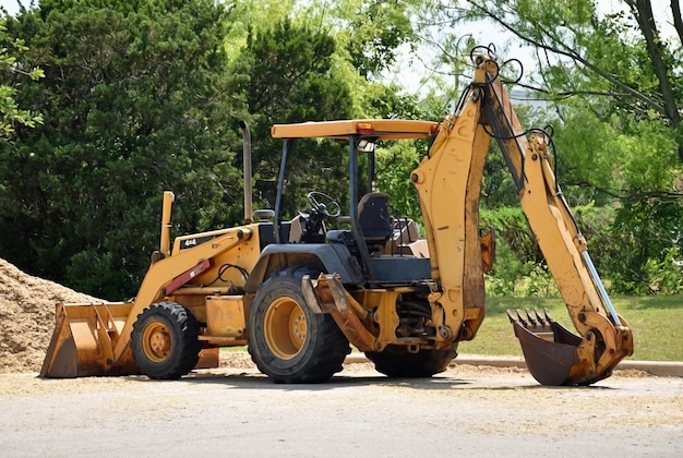 Photo a bulldozer is sitting in the dirt near a pile of plow