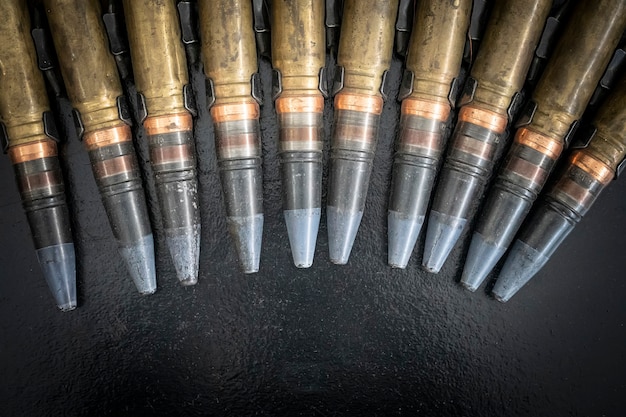 Bullets for an artillery machine gun. Weapons cartridges machine gun belt large caliber.