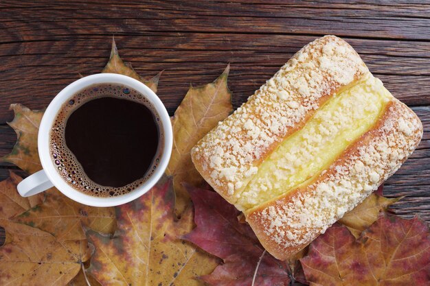 Bun with cream and coffee