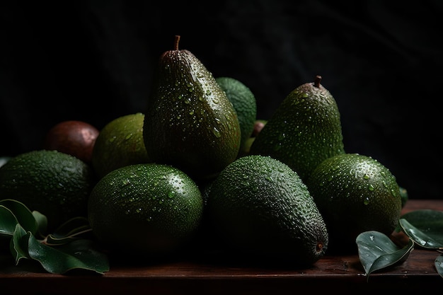 A bunch of avocados on a table with leaves on it