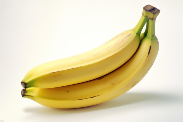 A bunch of bananas are sitting on a white surface.