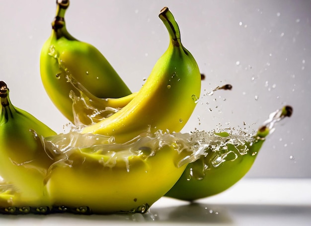 A bunch of bananas that are being splashed with water