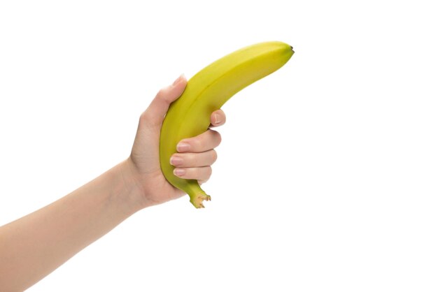 A bunch of bananas in woman hand isolated on white background