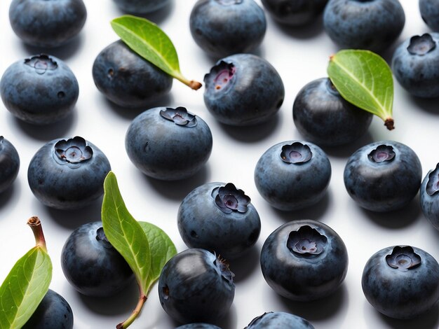 a bunch of blueberries with leaves on them