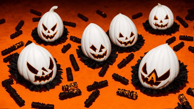 a bunch of candy eggs are on a table with one that says  happy halloween