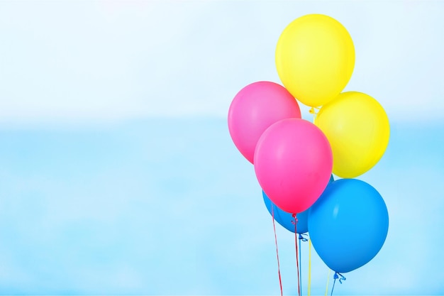 Bunch of colorful balloons on blue background