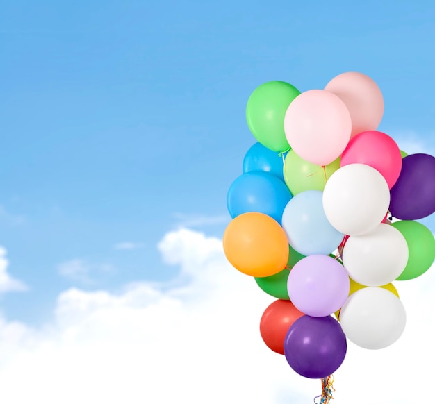 Bunch of colorful balloons on blue background