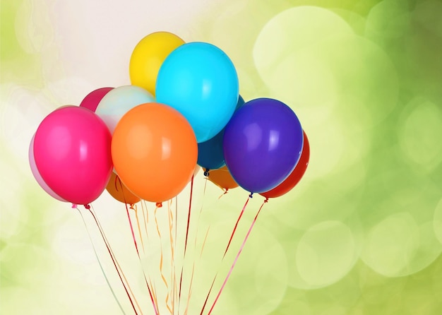 Bunch of colorful balloons on light background