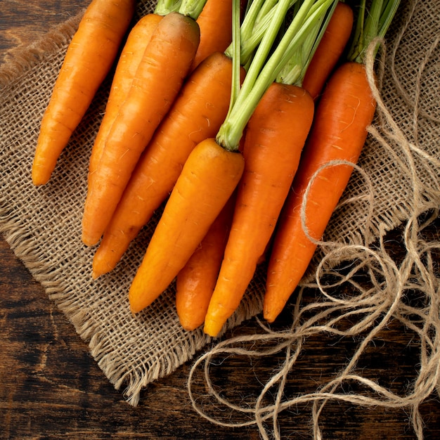 Bunch of fresh carrots on cloth