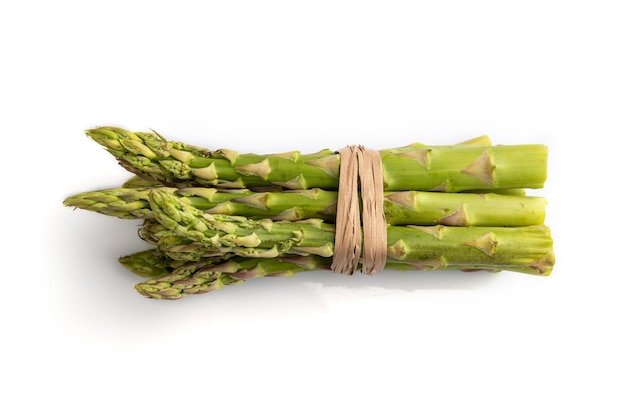 Bunch of fresh green asparagus isolated on white background Top view close up