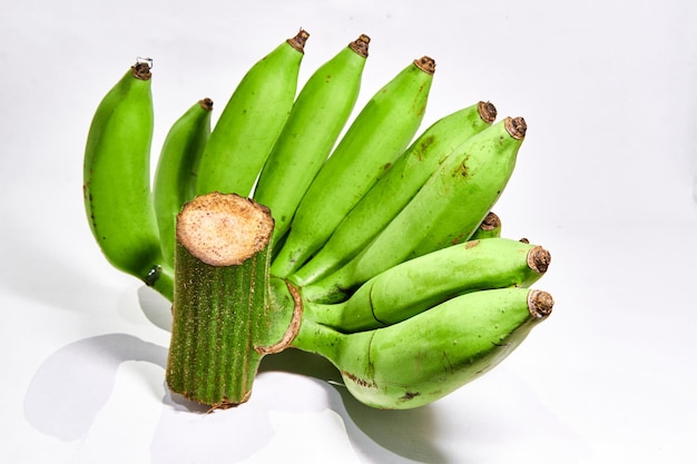 Bunch of fresh green bananas on a white background