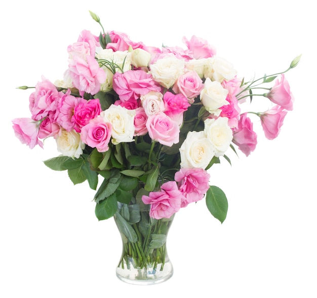 Bunch of fresh pink and white fresh roses and eustoma flowers in glass vase isolated