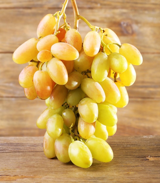 Bunch of grape on wooden background