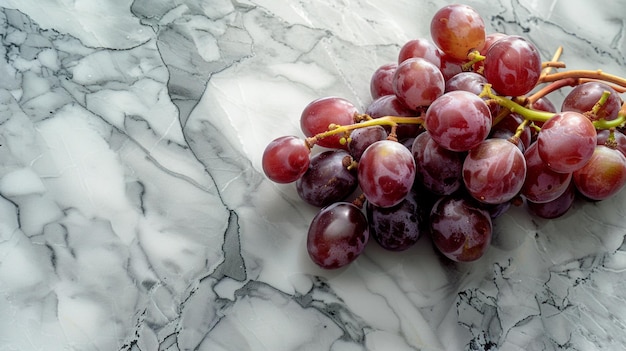 a bunch of grapes with a yellow stem on the top