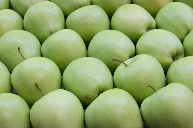 Bunch of green apples in supermarket