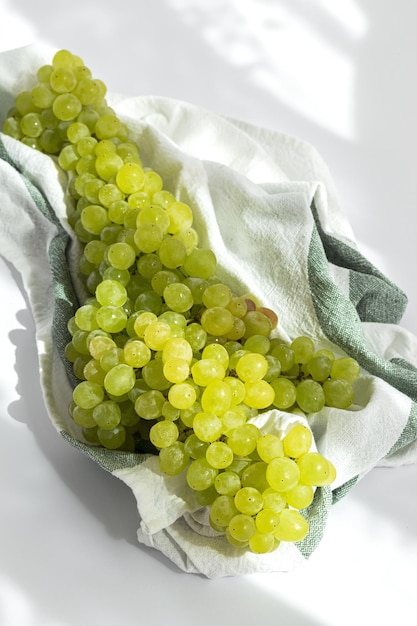 Bunch of green grapes on white background