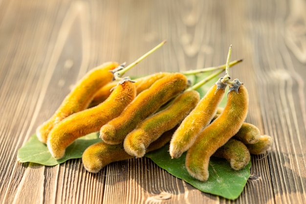 Bunch of Mucuna pruriens on wooden table