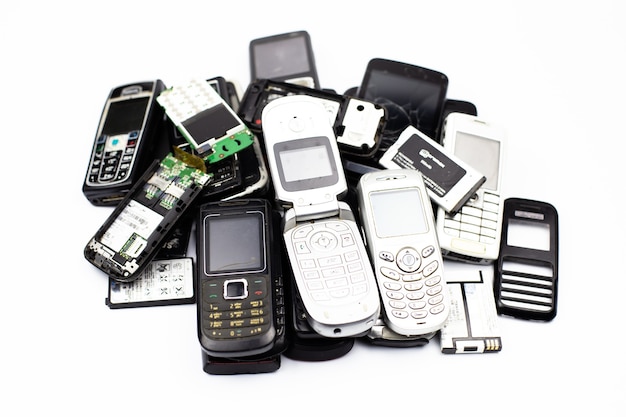 Bunch of old cell phones mobile communication retro broken white button tube