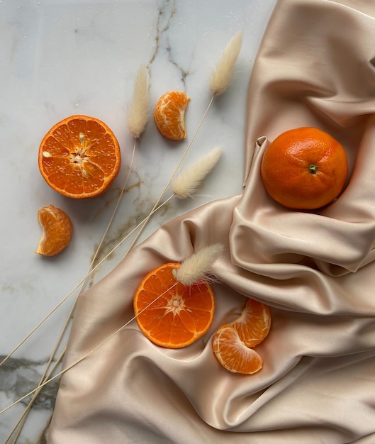 A bunch of oranges and some other oranges on a table.