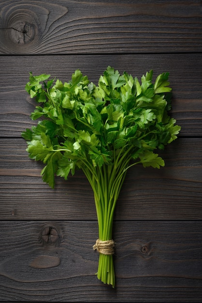 Bunch of parsley on wooden background