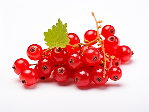 a bunch of red berries with a green leaf on top