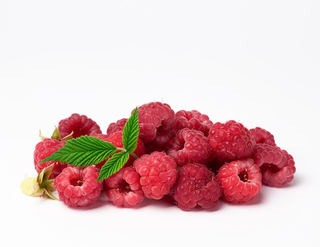 Bunch of red ripe raspberries on a white background