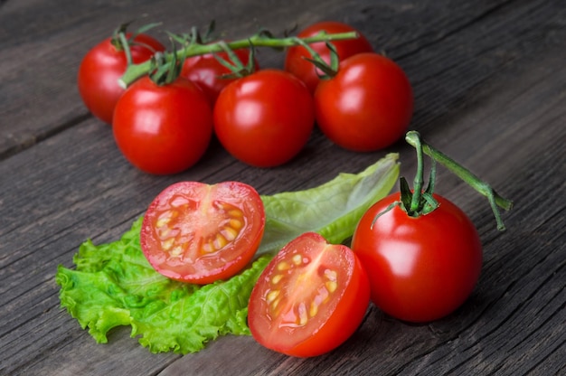 Bunch of ripe delicious red cherry tomatoes closeup